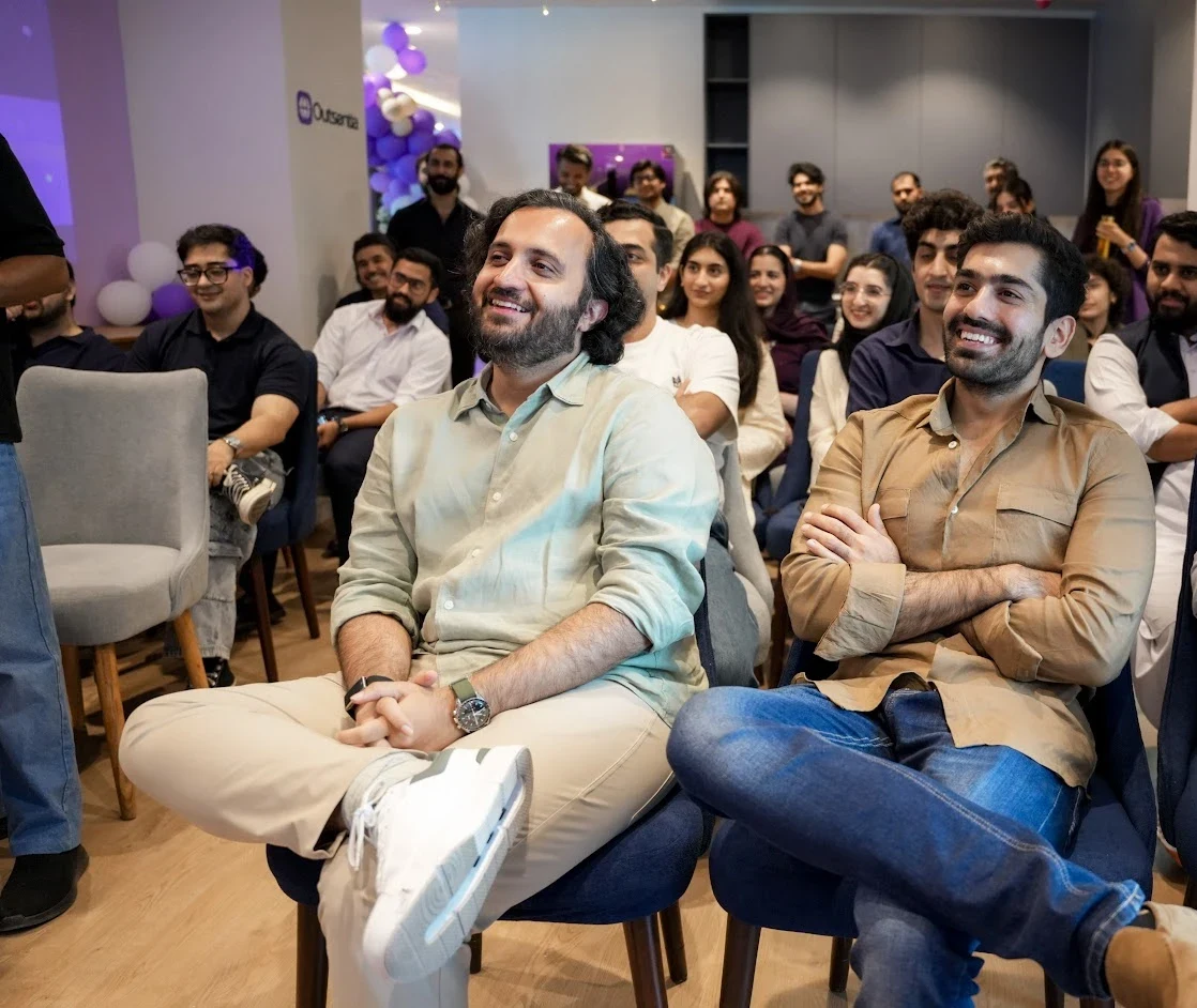 The Outsentia team watching a talk at the campus launch