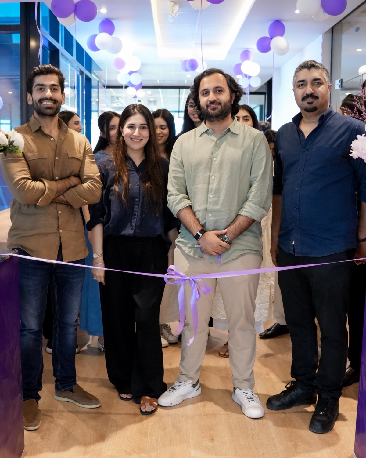 The Outsentia founders and team at the ribbon before the campus opening
